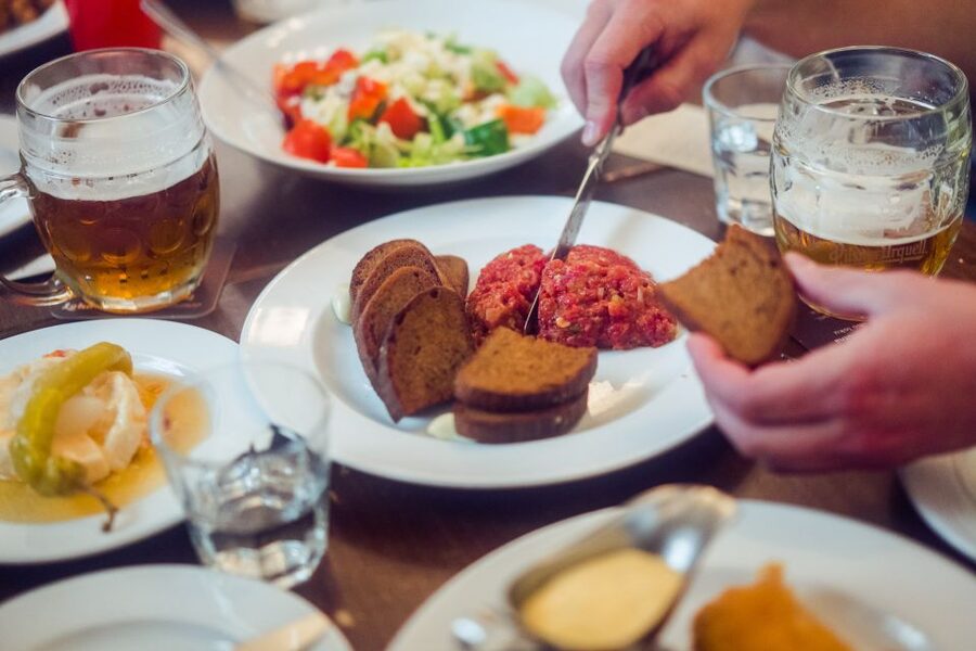 Delicious Food Tour by Prague Food Tour - Old Town Square between bites