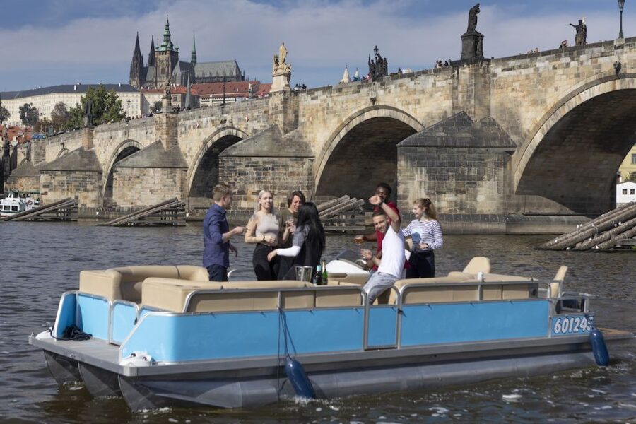 Prague: Beer Boat Tour - Meeting the boat between two river landmarks