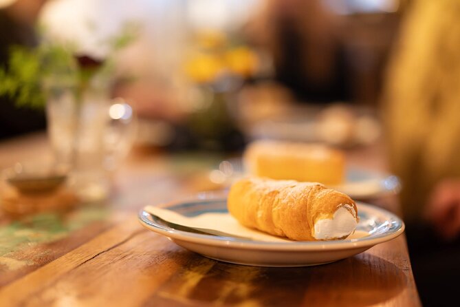 Prague by Night: Drinks & Food Tour with Eating Europe - Garlic rolls near Charles Bridge