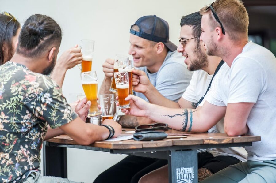 Prague: Castle Side Breweries & Pubs Guided Walking Tour - Crossing Charles Bridge into Mala Strana