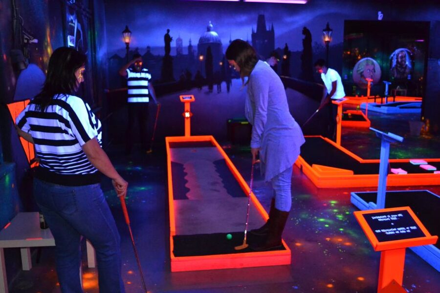 Prague: Glow Golf Mini Golf Game by UV Light - Table Games, Drinks, and Waiting Time