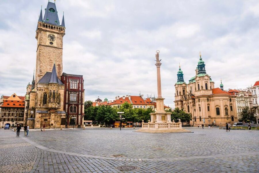 Prague: Old Town Square and Astronomical Clock Audio Guide - St. Nicholas Church, the Jan Hus Monument, and the wider square