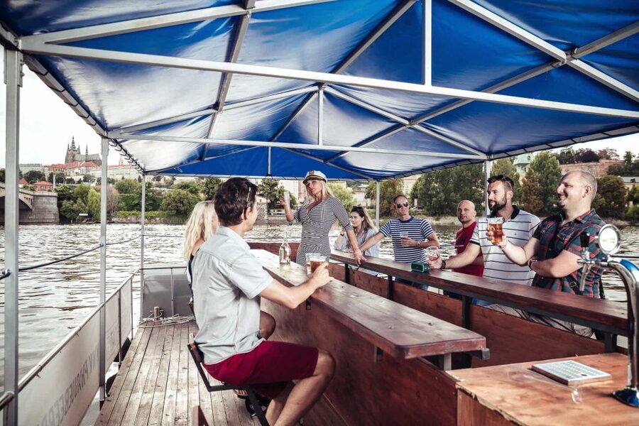 Prague: Private Cycle Boat River Tour with Beer or Prosecco - A party boat with Prague views
