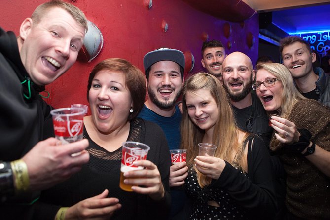 Prague Pub Crawl with Unlimited Drinks & 5 story club Entry - Walking through Prague’s Old Town at night