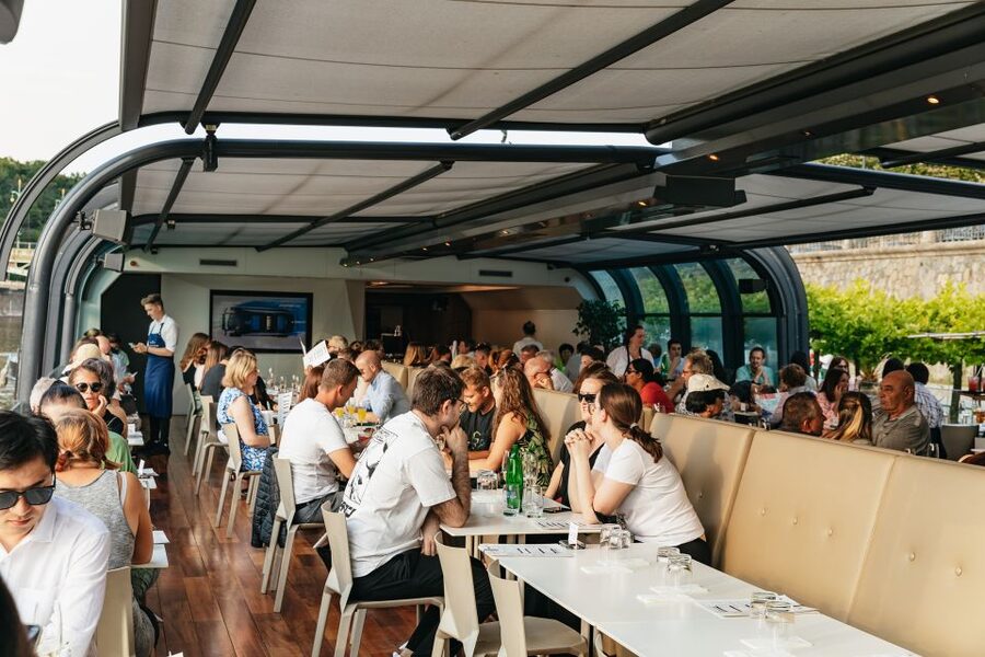 Prague: Sightseeing Dinner Cruise on Open-Top Glass Boat - The welcome drink and the first river views