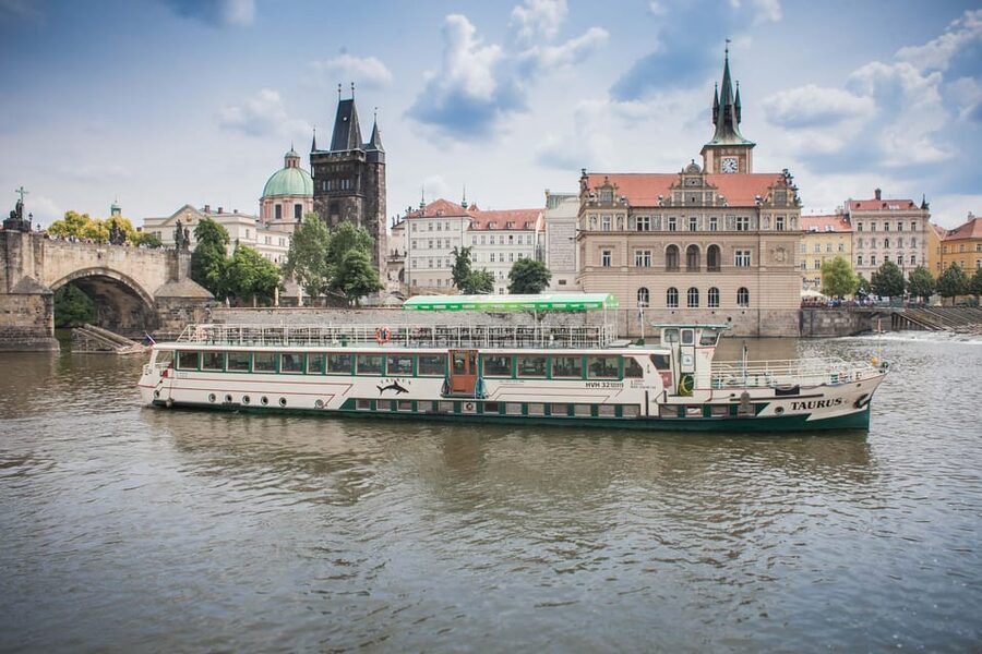 Prague: Vltava River Evening Dinner Cruise - A candlelit view of Prague from the Vltava
