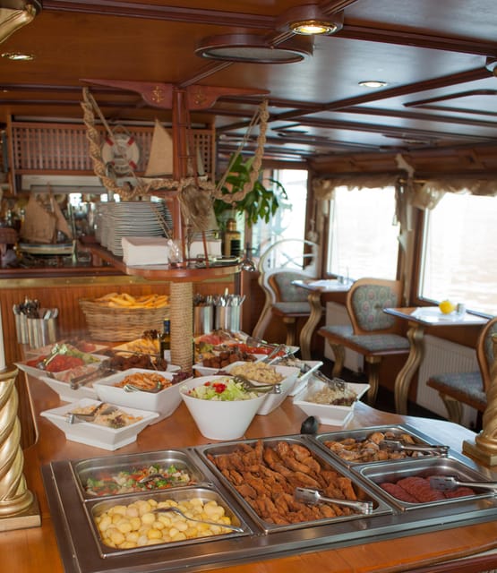 Prague: Vltava River Evening Dinner Cruise - Food, seating, and the changing boat